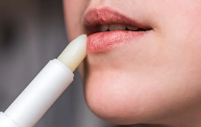 Woman Applying Chapstick