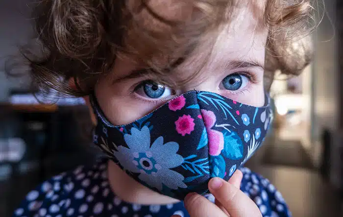 Child Wearing Patterned Face Mask